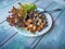 Fried eggplant and a leaf of red lettuce on a round plate