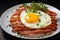 fried eggs with bacon and herbs, delicious breakfast, still life on a dark background