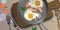 Fried eggs with bacon, vegetables and herbs. Vector.