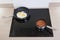 Fried eggs and baked beans cooking induction hob