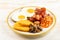 Fried eggs with bbq sausage, nuggets and mushrooms. Î’reakfast concept