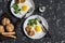 Fried eggs, broccoli, chicken meatballs, homemade whole wheat bread - tasty simple dinner. On a dark background