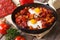Fried eggs with chorizo on Flemish recipe in the pan