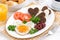 Fried eggs in the form of heart for breakfast Valentine\'s Day