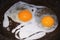 Fried eggs in frying pan. Protein and two yolks. Close-up.