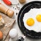 Fried eggs on a pan