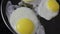 Fried eggs in pan closeup