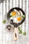 Fried eggs, sausage in iron pan -  Healthy food english breakfast