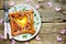 Fried eggs with sausage and vegetables in the shape of heart , romantic food for lovers