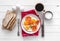 Fried eggs served on a plate, topview