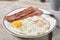 Fried eggs with turkey bacon