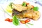 Fried fish fillets with lemon, chili peppers slice on white plate