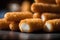 Fried fish fingers on a black background. Shallow depth of field