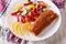 Fried fish with fresh vegetable salad on the plate closeup. hori