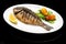 Fried fish with lemon on a plate. healthy food