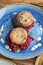 Fried fish rissole served with beetroot on blue plate on wooden table