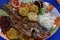 Fried fish with vegetables rice and frijoles
