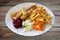 Fried fish - zander/ sander/ pikeperch, salad and french fries on plate