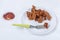 Fried Gobi Manchurian dry on white plate with ketchup on white background