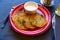 Fried grated potato pancakes with sour cream