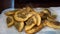 Fried gyoza dumplings with mushroom filling. Golden color hot crunchy dumplings cooked in a pan