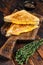 Fried ham and melted cheese sandwich. Dark wooden background. Top view
