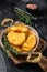 Fried Hash brown potato, hashbrown in a skillet. Black background. Top view