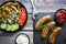 Fried homemade sausages on a wooden background. With sauces. lunch