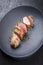 Fried Iberian pork fillet sliced with spice in a cast iron design plate