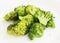 Fried inflorescences of broccoli with provencal herbs on white plate