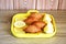 Fried Kubbeh in yellow plate & lemon slices