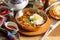 Fried lagman. Fried noodles with lamb, vegetables, egg and adjika