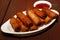 Fried lumpia shanghai with dip sauce for appetizer