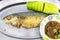 Fried mackerel with cucumber and Nam Prik on the long aluminium