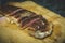 fried meat steak with blood on a cutting board, marbled beef steak, medium rare steak