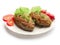 Fried meatballs with salad, dill and tomatoes