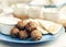 Fried minced meat with sauce and tortillas, traditional Greek lunch on a blue plate in a restaurant