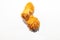 Fried mouth-watering two chicken wings in a sauce and brown breading lie side by side in a yin and yang pose isolated on an empty