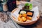 Fried Mozzarella Cheese Balls served with mayonnaise and thousand island sauce in wooden bowl