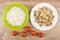 Fried mushrooms in plate, rice in bowl, tomatoes on table