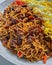 Fried noodles with sweet soy sauce seasoned beef plus cooked omelet