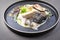 Fried Norwegian skrei cod fish filet with mashed potatoes, mushroom and lemon curd on a modern design plate