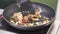 Fried onion in oil in a frying pan. Clip. Vegetarian stir fry. Healthy eating. Top view. Top view stir fry vegetables in