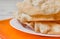 Fried pappadum on a white wooden table