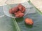 Fried parippu vada placed in a banana leaf in traditional fashion.