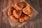 Fried peremyachi, belyashi, meat pies on a dark background. Traditional Russian pies. Russian