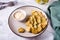 Fried pickles appetizer and sauce in a bowl on a plate. Homemade snack