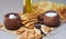 Fried pies, cheese, sunflower oil, milk and bagels on a plate cl