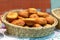 Fried pies in a wicker basket on the counter in the bakery in the supermarket