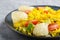 Fried pomelo with tomatoes and avocado on gray concrete background, side view, close up